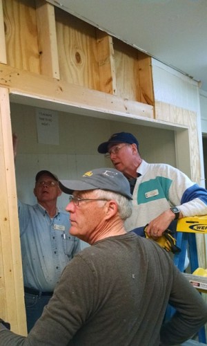Jim, Harry and Ken removing a wall
