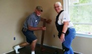 Del and Carol putting down the last of the living room flooring
