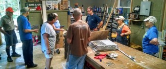 Camp Director giving us a tour of the tool shed