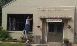 Contractor installing new windows in Dining Hall