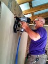 Dave installing paneling in new shop