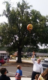 Pastor Harvey used a helium balloon to demonstrate ascension to the children.