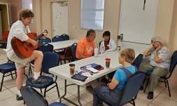 Wanda accompanying the singing at morning devotion